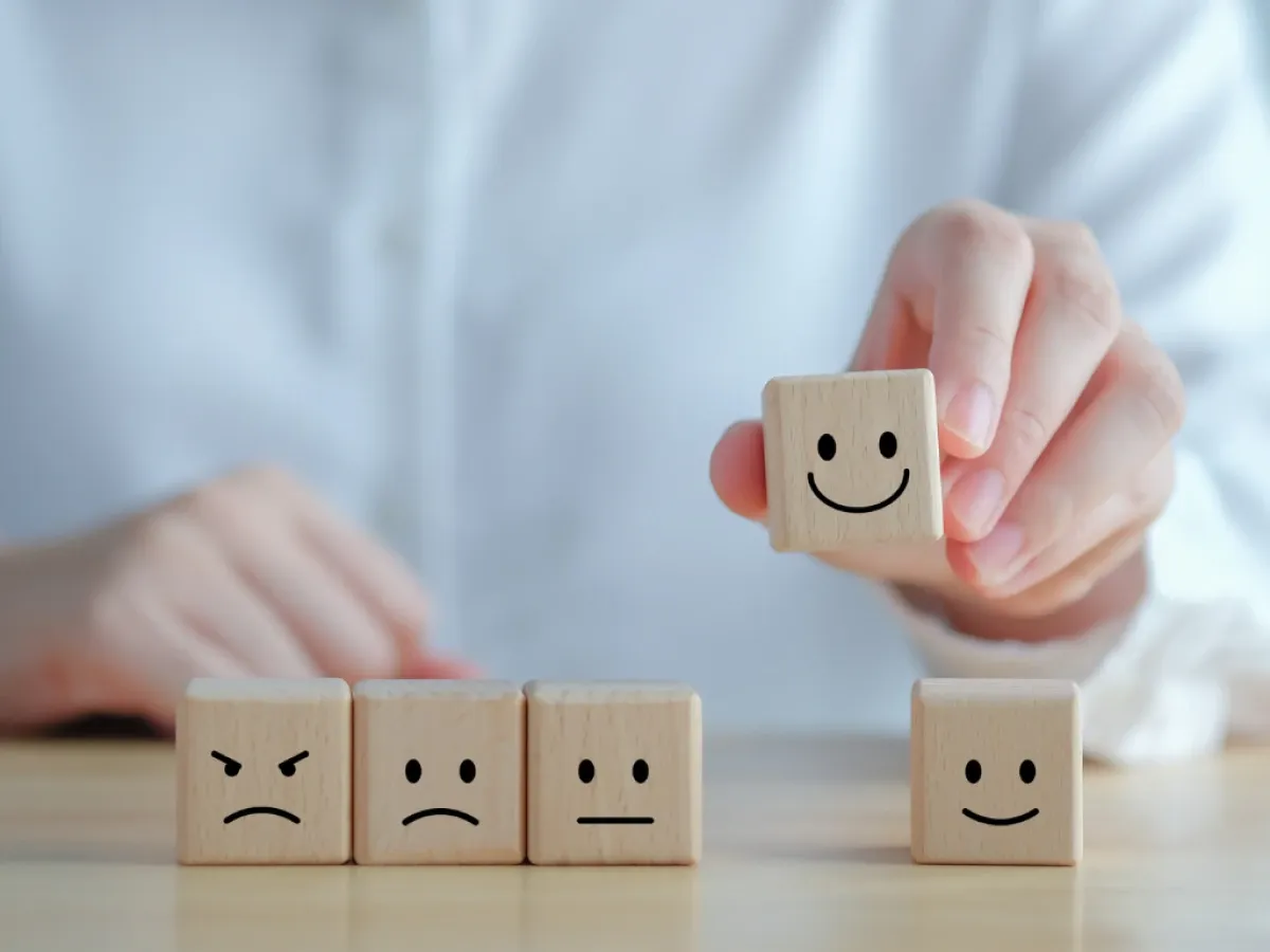 Image showing multiple blocks with hand-drawn frowning and smiling faces